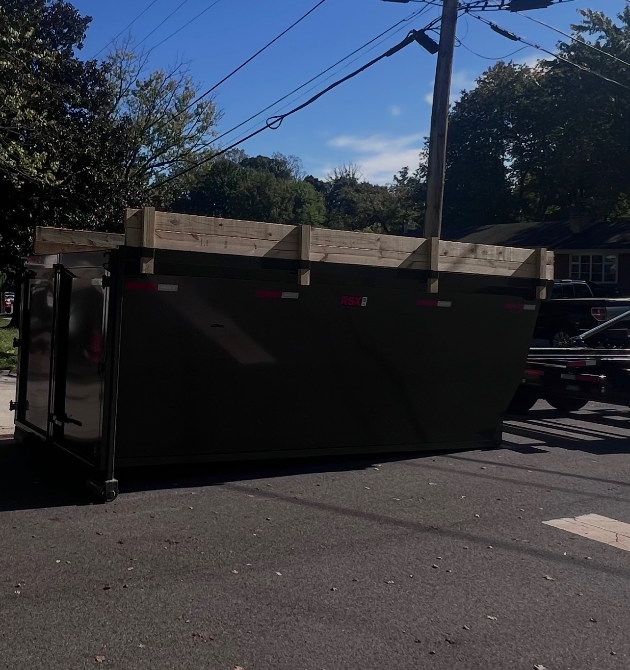 A Bin & Gon dumpster loaded during a household trash cleanout in Maryland