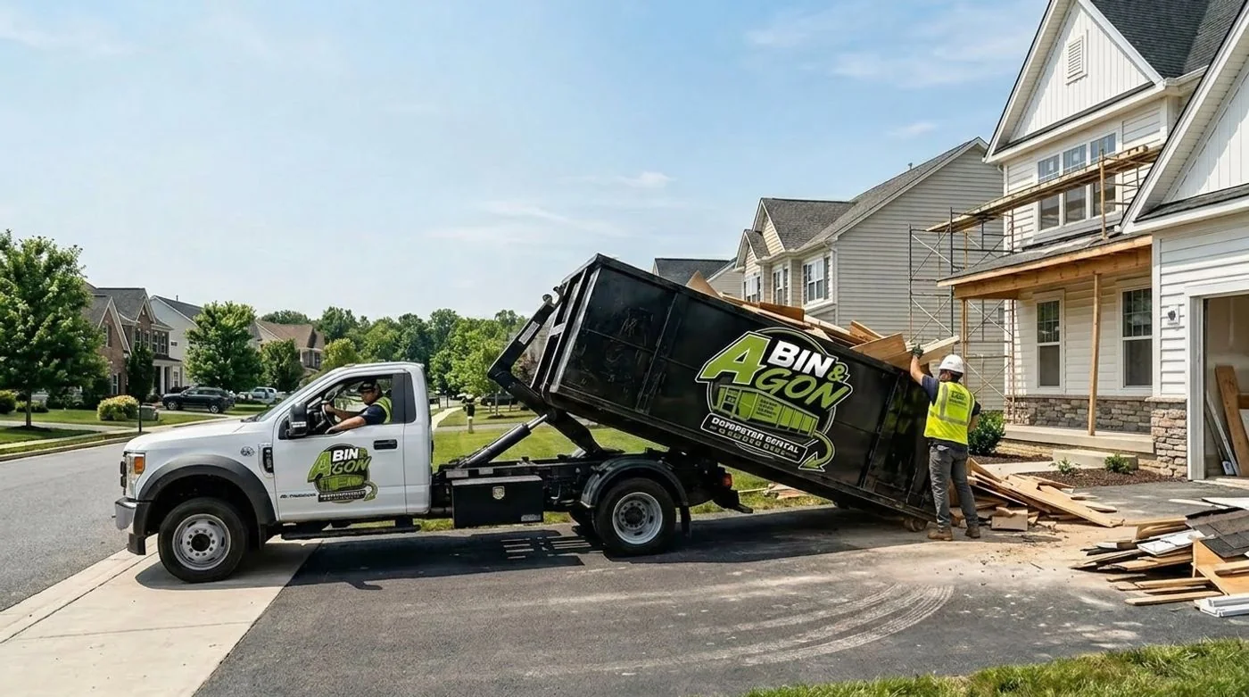 Branded A Bin & Gon dumpster truck making a delivery in the DMV area